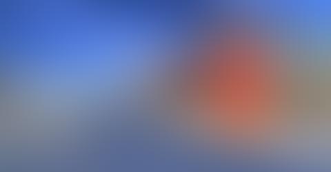A blurry image with blue and orange hues.