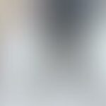 Pale cool-toned blur with central shadow