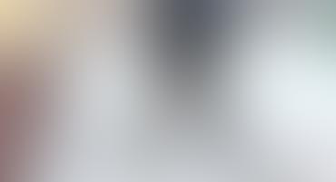 Pale cool-toned blur with central shadow