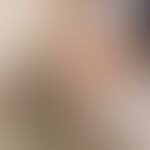 A blurred image with indistinguishable colors and shapes.