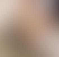 A blurred image with indistinguishable colors and shapes.